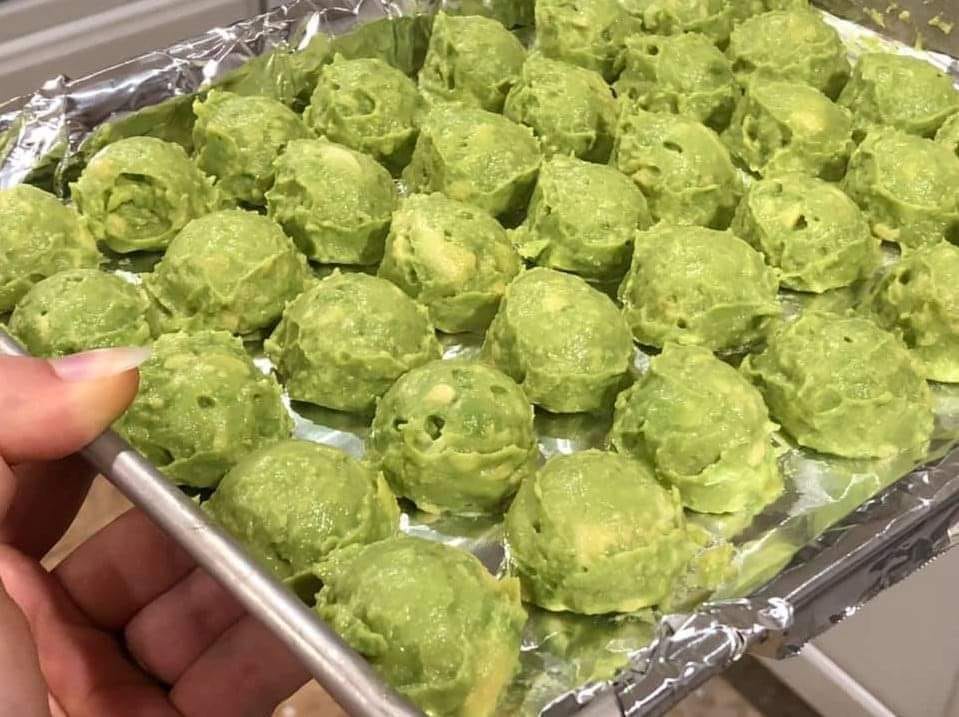 These green balls appear to be portions of mashed avocado. Here is a simple recipe for making mashed avocado and ideas on how to use it: