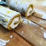 That sounds delicious! Here’s a recipe for a lemon and coconut cake roll with a powdered sugar and lemon zest topping: