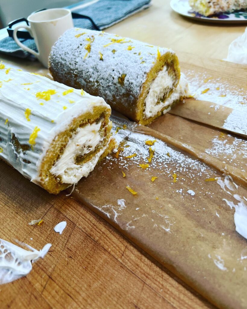 That sounds delicious! Here’s a recipe for a lemon and coconut cake roll with a powdered sugar and lemon zest topping: