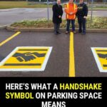 What does the handshake symbol on a parking space mean?