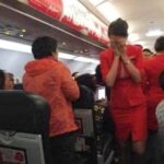 Young girl gets saved on the plane by the flight attendant