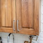 Clean grimy kitchen cabinets with this 2-ingredient solution