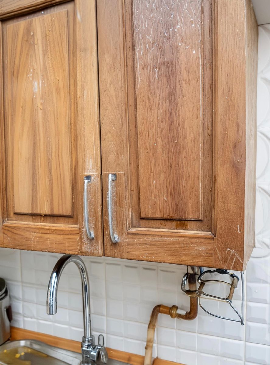 Clean grimy kitchen cabinets with this 2-ingredient solution